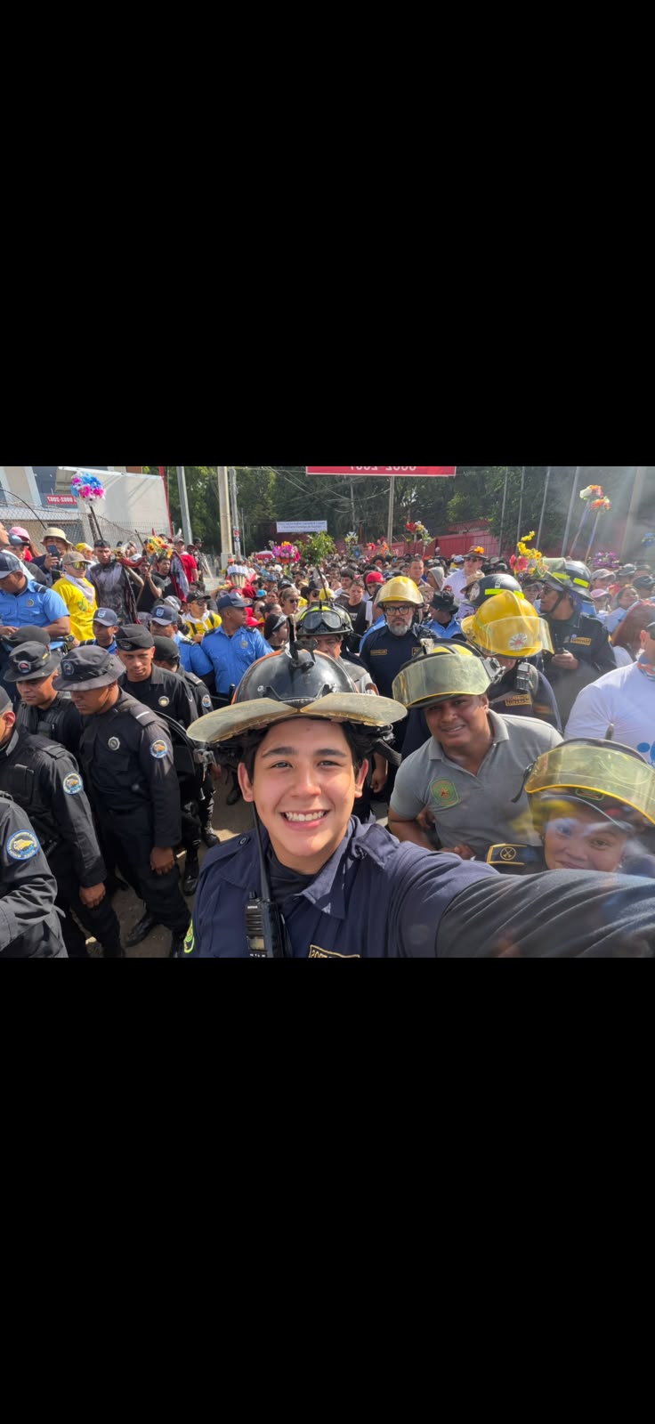 Juan with fellow firefighters at a crowded community gathering